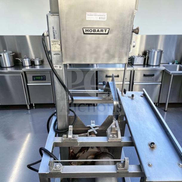 Hobart 5701D commercial meat saw, 3 HP, 3 phase, heavy-duty, excellent condition, fully tested, visible brand label, silver.