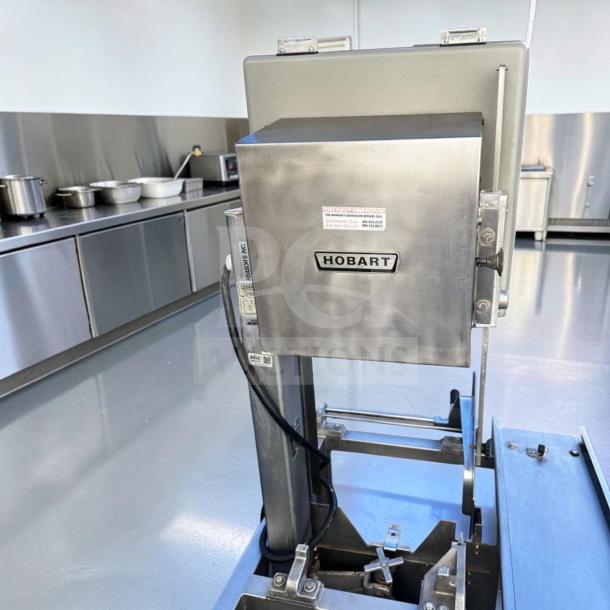 Hobart 5701D commercial meat saw, 3 HP, 3 phase, in superior condition, fully tested. Hobart label visible.
