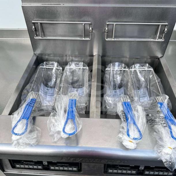 Prime Condition Frymaster FPP245 commercial gas fryer with split pots, built-in filtration, and protective coverings on baskets.
