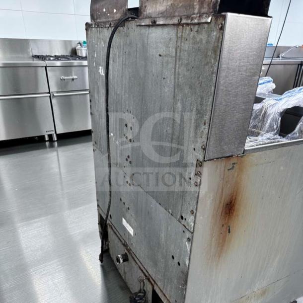 Frymaster FPP245 commercial gas fryer, split pots, built-in filtration, operational, visible wear on exterior, model label visible.