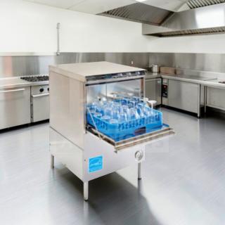 Flawless Perlick PKHT24 glasswasher, 24" wide, high-temp door type, 30 racks/hour, fully tested, stainless steel, in kitchen.