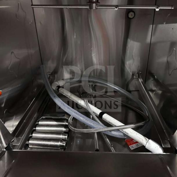 Flawless Perlick PKHT24 glasswasher interior, high-temp door type, 24” wide, commercial grade, hoses and components visible.
