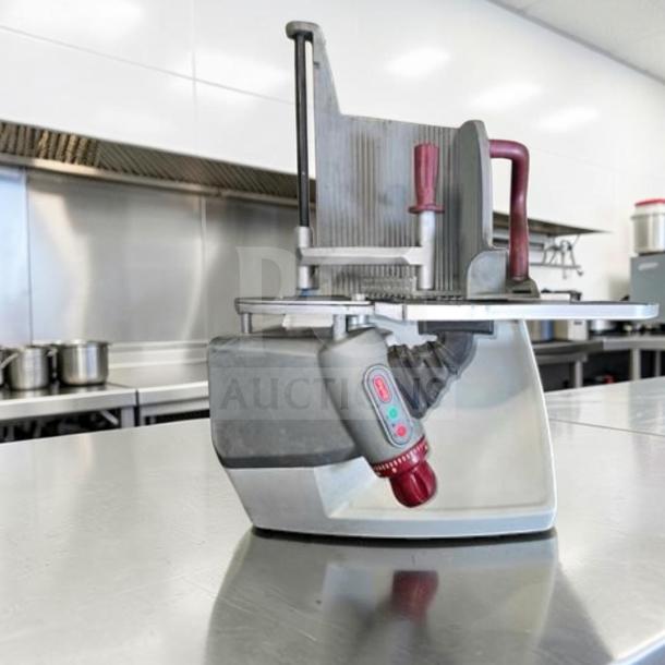 Berkel X13-PLUS 13" manual gravity feed meat slicer in exceptional condition, 1/2 HP, fully operational, visible controls.