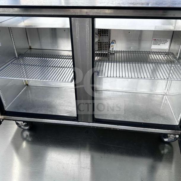 True TSSU-48-12-HC sandwich prep table, top-tier condition, refrigerated base, 115V, stainless steel, dual shelves visible.