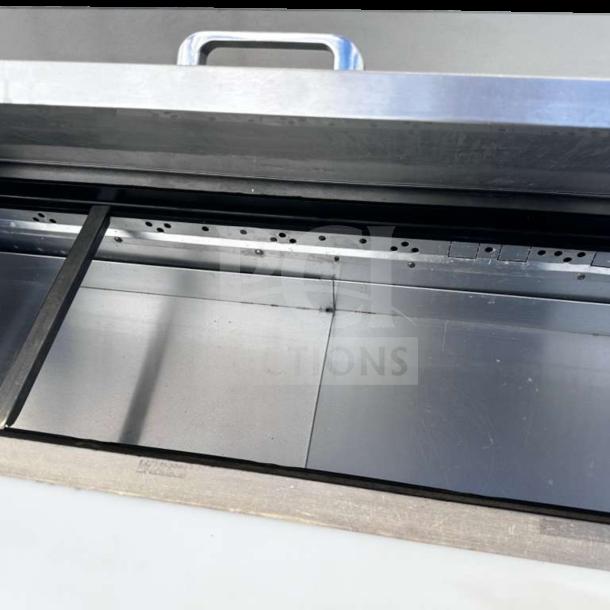 Top-tier condition True TSSU-48-12-HC prep table interior; stainless steel, clean, spacious, fully operational, 115V.