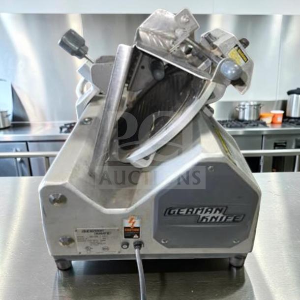 Exceptional condition German Knife GS-12M slicer, 12-inch blade, 1/2 HP motor, UL & NSF certified, fully operational.
