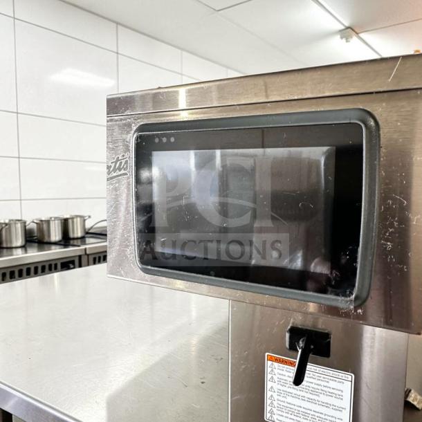 Wilbur Curtis G4TB commercial tea brewer, 3-5 gallon capacity, like-new, stainless steel, digital controls visible.