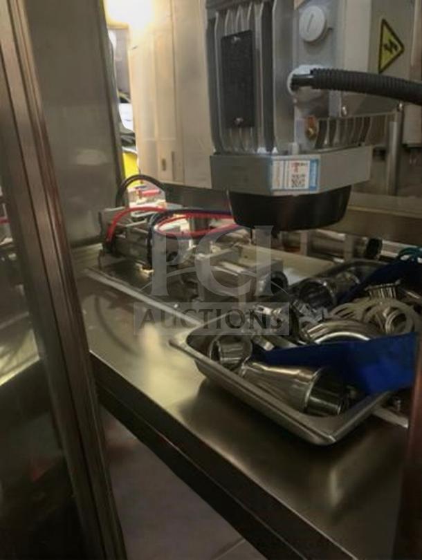 Premium TANG two-head automatic filling machine for sauces, model TAN-L-FIL-0423, fully tested, excellent condition.