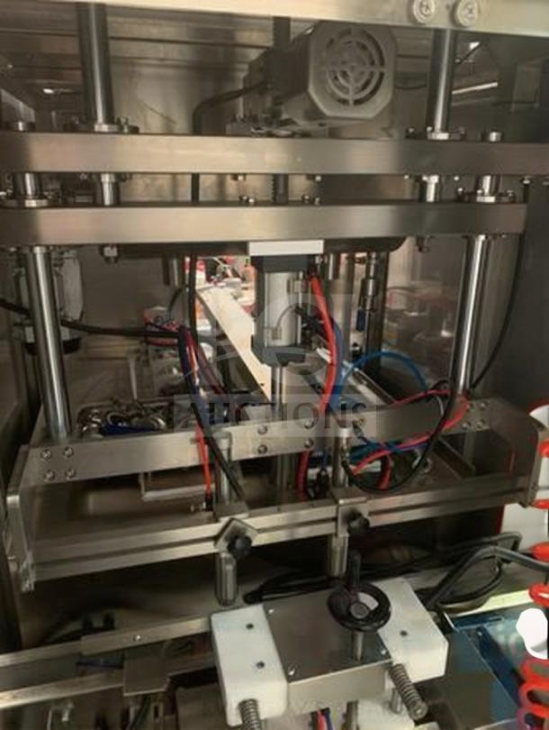 TANG Two-Head Automatic Filling Machine, model TAN-L-FIL-0423, shown in premium condition, designed for sauces and liquids.