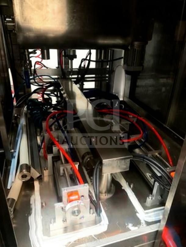 TANG Two-Head Automatic Filling Machine, premium condition, for sauces and liquids, fully tested, model TAN-L-FIL-0423.