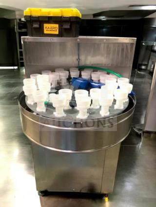 Tang Rotary Round Bottle Washer in superb condition, features automatic inner/outer rinse, fully tested, model TNG-L-WASH-0420.