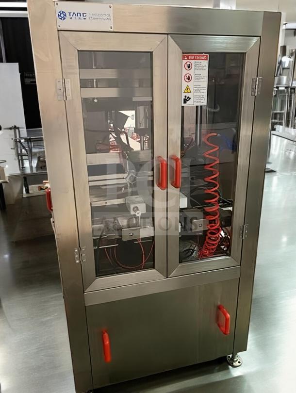 Tang Machinery Four-Station Semi-Automatic Vacuum Capper, premium condition, stainless steel, with visible control panel and safety labels.