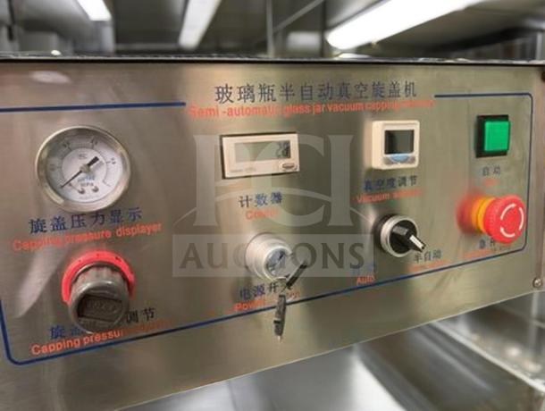 Tang Machinery Four-Station Semi-Automatic Vacuum Capper control panel with pressure display gauges and operation dials.