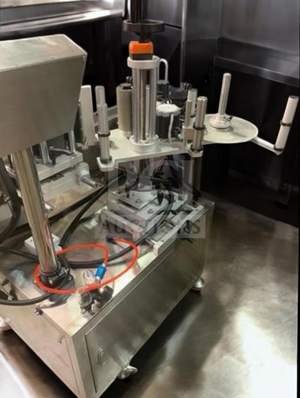 Tang TGM-TY01 automatic round bottle labeling machine with 360° wrap-around capability in premium condition; fully operational.