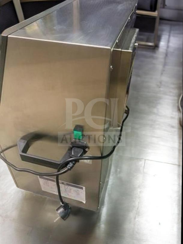 Tang Automatic Round Bottle Labeling Machine, model TGM-TY01, premium condition, stainless steel, power cord attached, operational.