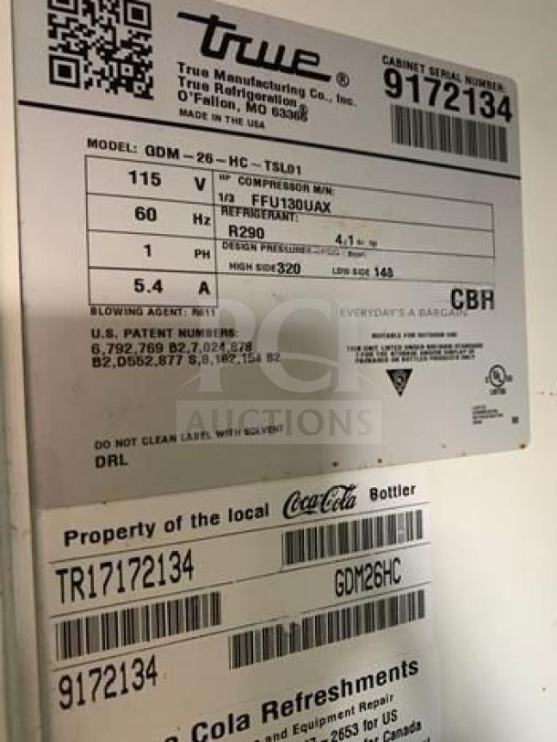 True GDM-26-HC-TSL01 commercial refrigerator label; Model GDM-26-HC-TSL01, 115V, R290 refrigerant. Serial 9172134. Made in USA.