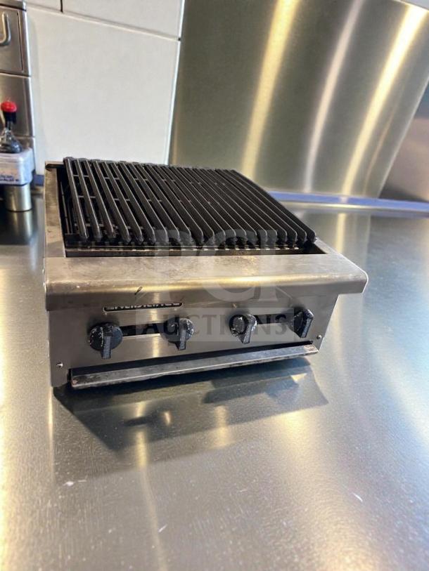 Commercial 4-burner gas charbroiler in outstanding condition. Heavy-duty stainless steel, natural gas, tested operational. Model CHAR-M-GAS-0543.