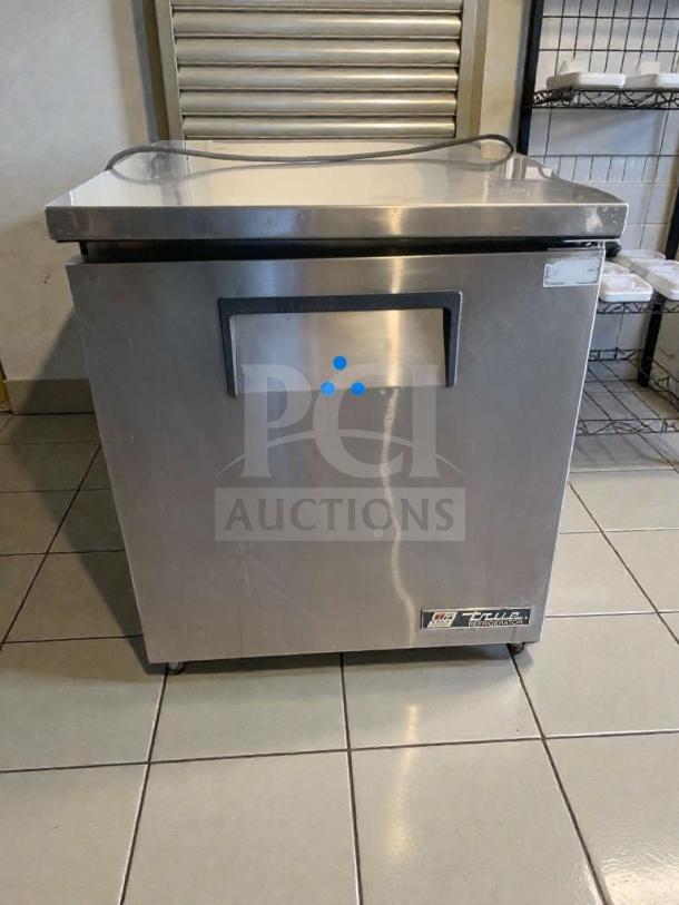 True TUC-27-LP undercounter refrigerator in immaculate condition, stainless steel finish, fully tested and working, 115V.