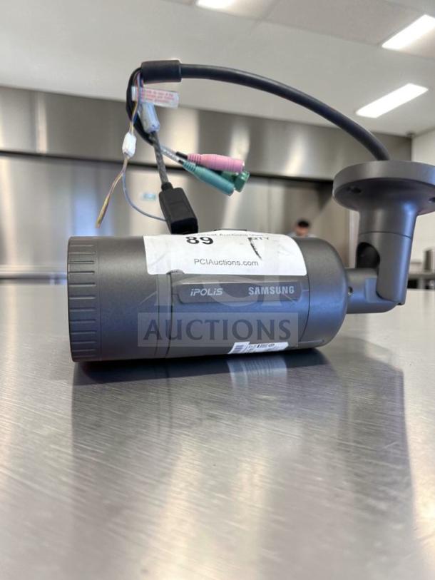 Samsung iPOLIS SNO-6084RN HD Network Bullet Security Camera, superior condition, PoE/12V/24V, fully tested, PCI Auctions label.