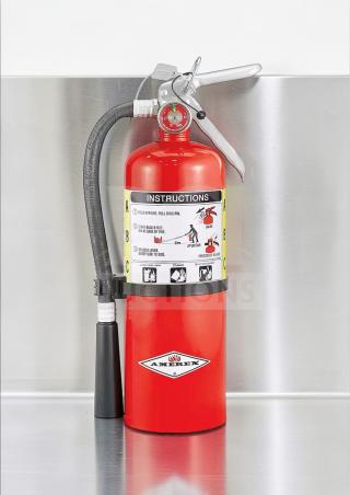 Commercial 5 lb ABC fire extinguisher, UL listed, 2A:10B:C rating. Prime condition for kitchen safety. Amerex logo visible.