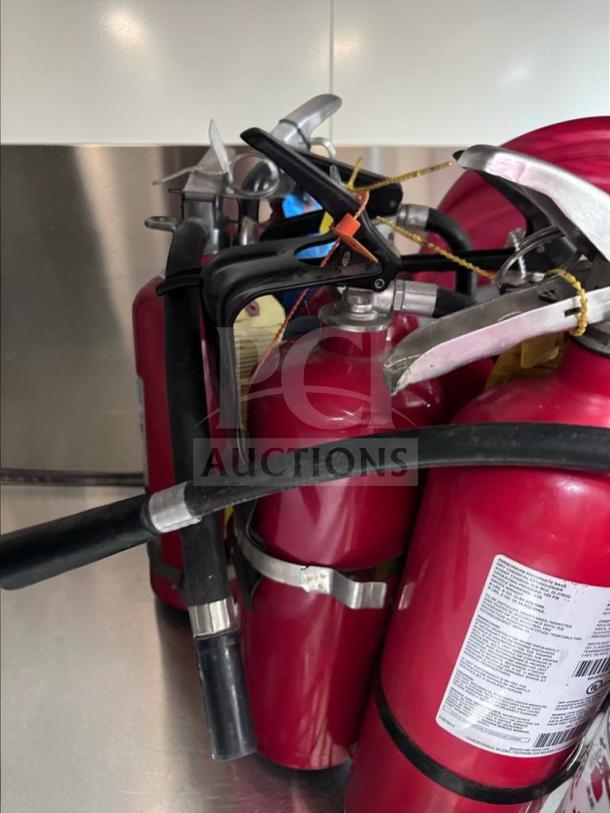 Prime condition 5 lb ABC fire extinguishers, rating 2A:10B:C, UL listed, ideal for restaurant use. Multiple units shown.