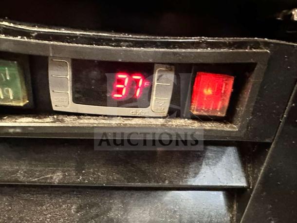 Display panel of Supera G1M-16-B-1 refrigerator showing temperature at 37°F, indicating operational status.