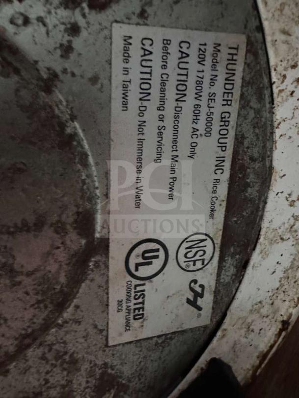 Label on Thunder Group SEJ-50000 rice cooker with NSF and UL listings. Caution: disconnect before servicing. Made in Taiwan.