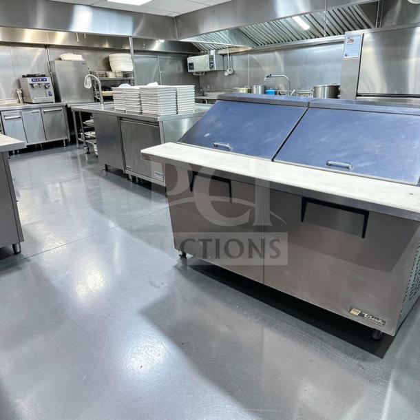 Elite condition True TSSU-60-24M-B-ST-HC refrigerated sandwich prep table, 60", 2 doors, stainless steel, fully tested.
