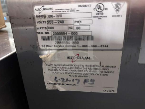 Alt text: Alto-Shaam 1000-TH/II Halo Heat® cook and hold oven label, showing model, voltage, and serial number.