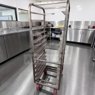 Mobile stainless steel bun pan rack, heavy-duty, superior condition, fully operational, commercial use, red casters.