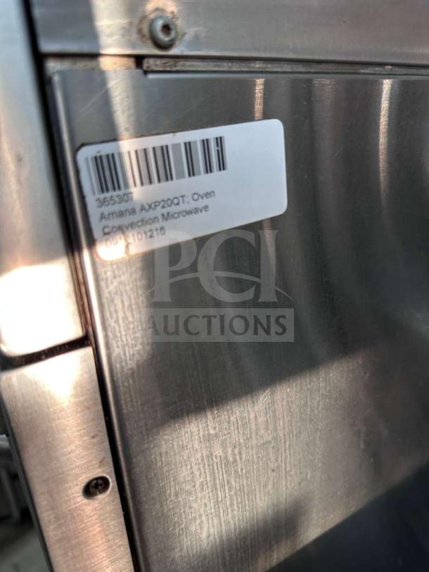 Amana AXP20 high-speed microwave convection oven with label showing model info and barcode, in elite condition.