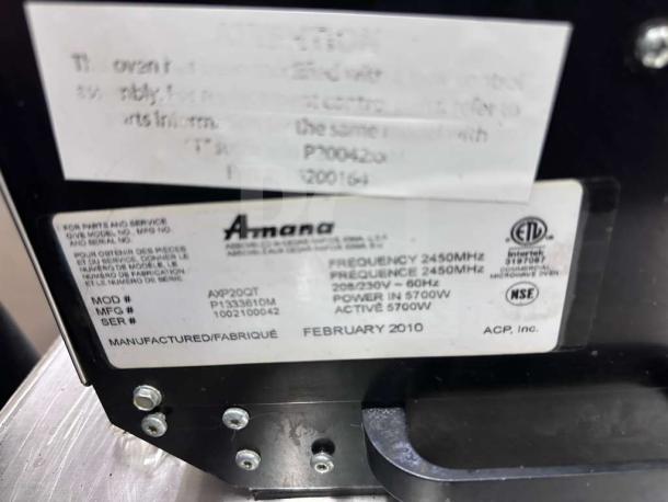 Amana AXP20 microwave convection oven label, showing model, serial number, and specifications, fully tested and operational.