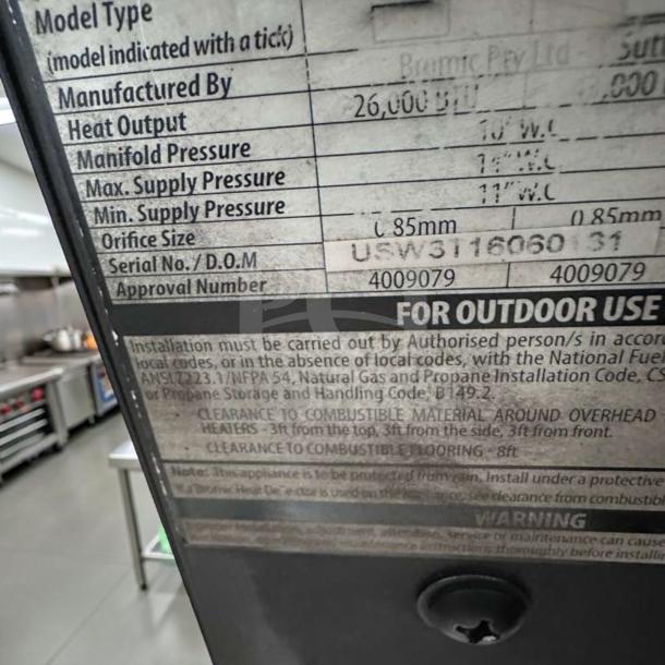 Label on Bromic Tungsten Smart-Heat gas radiant heater. Shows specifications: heat output 26,000 BTU, approval number 4009079.