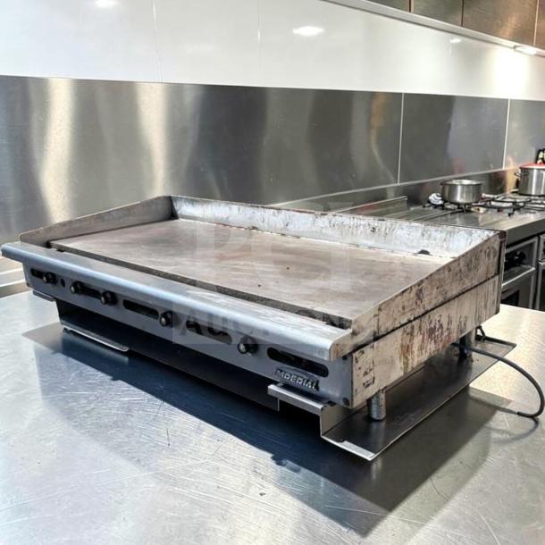 Imperial ITG-60 60" commercial gas griddle with 1" steel plate, thermostatic controls, in superior condition, natural gas.