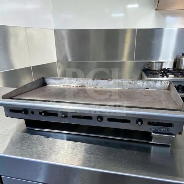 Imperial ITG-60 60" gas griddle with 1" steel plate, thermostatic controls, natural gas; excellent condition, fully operational.