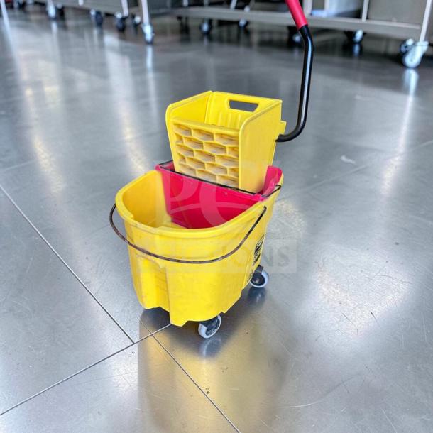 Rubbermaid WaveBrake 35 Qt. mop bucket, superb condition, yellow with red wringer, dirty water separator, heavy-duty use.