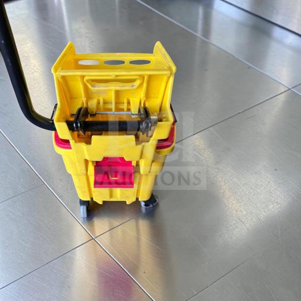 Rubbermaid WaveBrake 35 Qt. Mop Bucket in superb condition, features side press wringer, dirty water separator, tested operational.