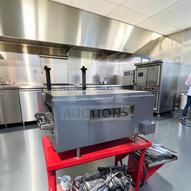 Star Holman QT14 commercial conveyor toaster oven in excellent condition on red cart, stainless steel finish, 208/240V.