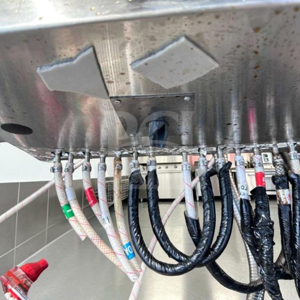 Advance Tabco SLI-12-36-7 underbar ice bin underside view showing piping and connections in stainless steel.