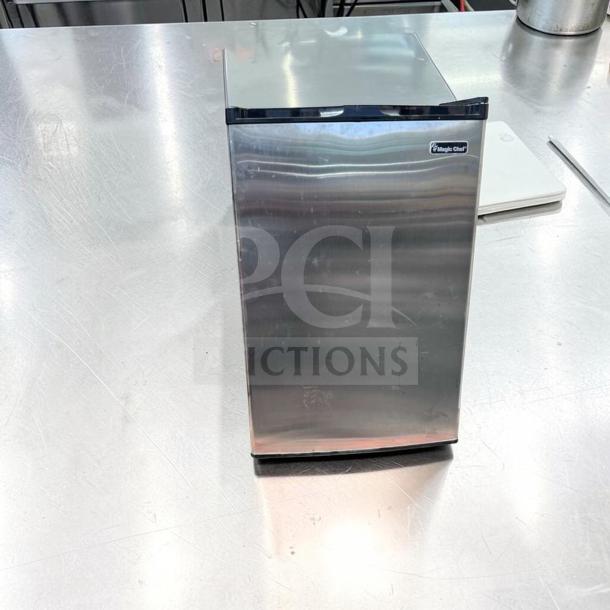 Magic Chef MCUF3S2 3 Cu. Ft. Compact Upright Refrigerator in excellent condition, stainless steel finish, space-saving design.