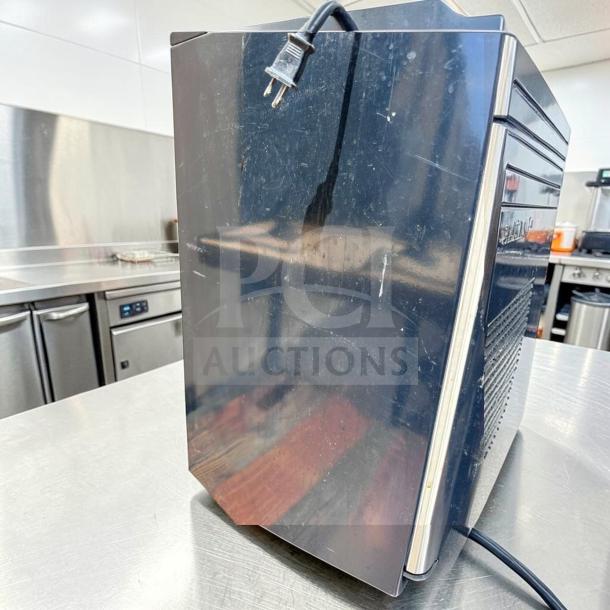 Euro-Gold W-995 undercounter fridge, 115V, compact size; black exterior with minor scratches; fully tested operational.