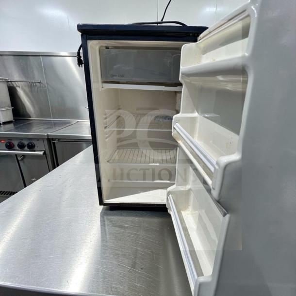 Euro-Gold W-995 undercounter fridge, 115V, open view, compact design, excellent condition, two wire shelves, door storage.