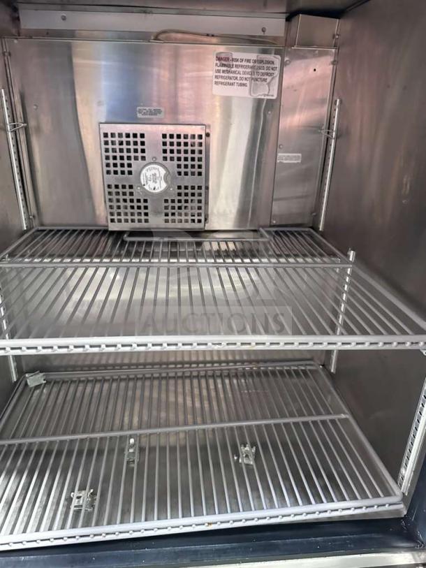 True TUC-27G-HC undercounter glass door refrigerator, stainless steel interior, 27", two adjustable shelves, excellent condition.