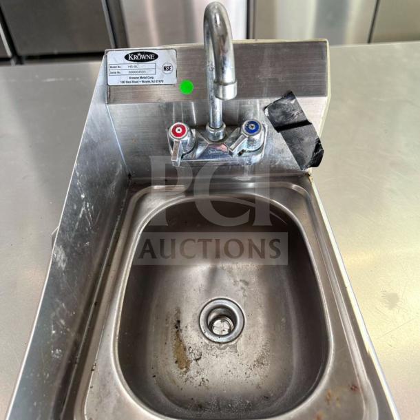 Krowne HS-9L wall mount hand sink, 9 3/4" x 11 3/4" bowl, low lead faucet, NSF certified, model tag visible, well-used condition.
