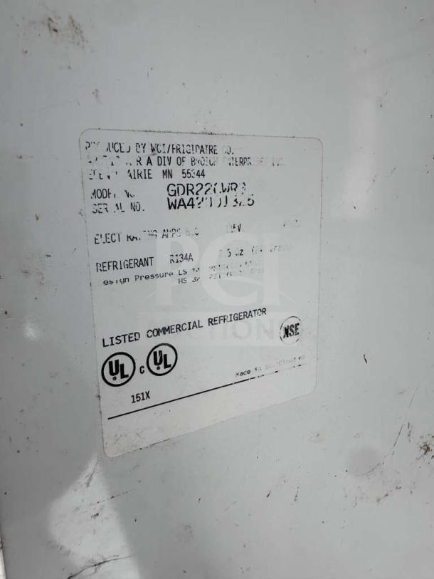 Arctic Air GDR22 label indicating commercial use, UL listed, 115V with R134A refrigerant, model and serial numbers visible.