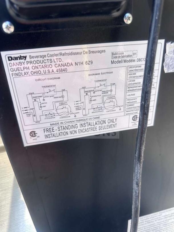 Label on Danby DBC120BLS-3 beverage cooler, showing model details, circuit diagram, and installation instructions.