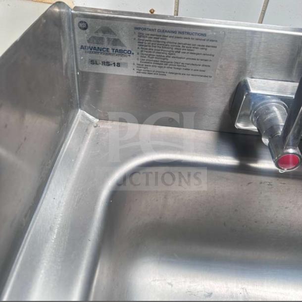Advance Tabco SL-RS-18 blender station with stainless steel sink, visible label, faucet, and cleaning instructions.