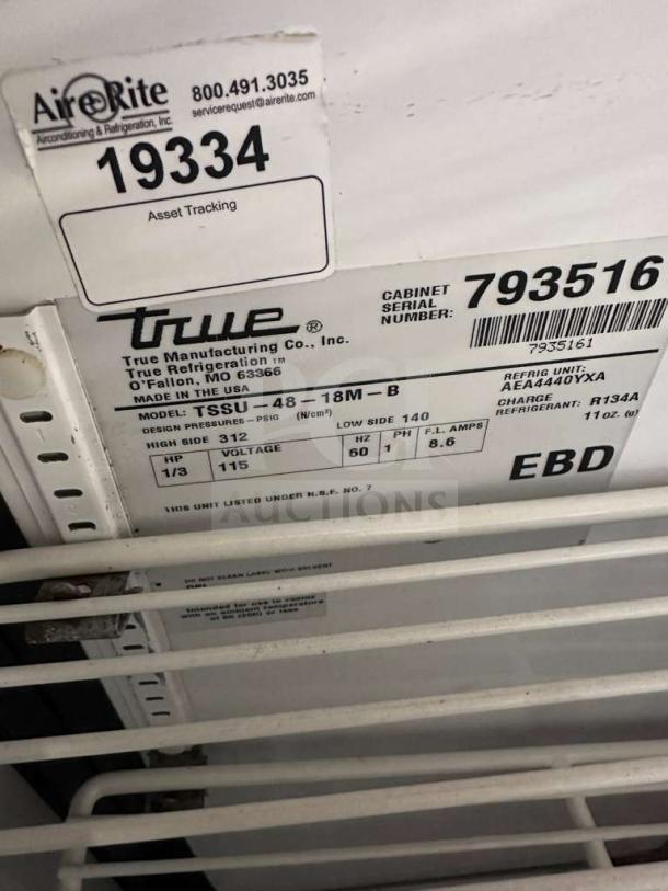 True TSSU-48-18M-B-HC refrigerated prep table tag, model info, and serial number 793516 shown.