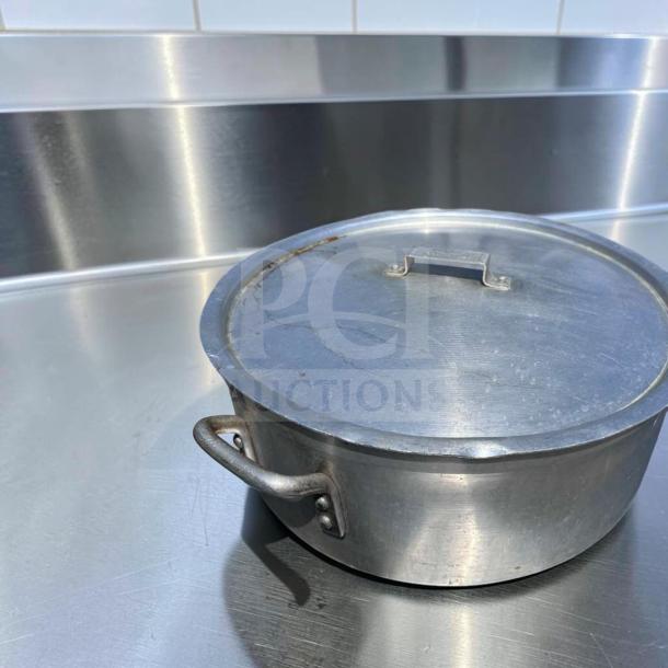 Heavy-duty commercial aluminum stock pot with lid, superior condition, suitable for restaurant kitchens, Generic Commercial.