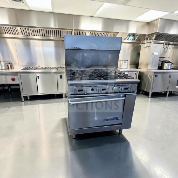 Imperial IR-6 36" commercial gas range with 6 burners and oven, in exceptional condition. Natural gas, heavy-duty, fully tested.